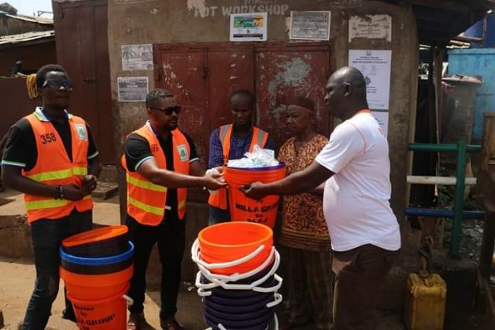 SLAJ DONATES VERONICA BUCKETS TO KROO BAY COMMUNITY - COVENANT NEWSPAPER2