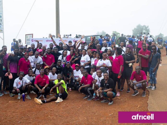By Alusine Joseph Mansaray. The Africell Health and fitness walk was well attended by staff from various parts of the country as they started from the Africell headquarter at Wilberforce and designated to Leicester Peak on Saturday the 20th May 2023. Addressing the gathering at the finished point, the Chief Cooperate Affairs Manager of Africell Jose Abass Bangura said every employer knows that the most important assets to any company are their employees as the ultimate goal employers want from employees is to reach maximum productivity levels and in a quest to accomplish such supporting fitness is one of the most beneficial choices any employer can make to encourage their workers to reach their full potential. Joe Abass Bangura furthered that as a company they decided to organize the Africell health and fitness walk to improve employees’ health and wellness, reduce healthcare costs, and increase engagement and job satisfaction. Also, Joe Abass Bangura said during the health and fitness work the management of Africell provided some first aid treatments and as well vehicles for those whom might get hurt during the work but however thank God there was no casualty during the process. Mr. Bangura continued that this initiative will help employees not to get sick easily as when an employee uses less sick days, they contribute more to overall productivity and reduce the hassle of trying to find replacements at the last minute. He added that employees who are fit creates a sense of confidence, which allows them to set higher goals and to always strive for excellence and as well encouraging exercise is a good way to promote teamwork which encourages personal growth, increases job satisfaction, and reduces stress during and after work. On his path, the Media Manager of Africell, John Konteh said as a company they decided to embark on lots of sporting activities like the health and fitness walk, the LELEMU inter-departmental football tournament, the Sports meet and the Africell Freetown marathon as a way to keep their workers fit physically and psychologically which help reduces employees’ stress levels as a good exercise has the phenomenal ability to lessen the amount of stress felt from physical and emotional tensions in life. John Konteh furthered it is obvious that employees who are not stressed are more focused as they contribute to a much higher level of productivity. Similarly, John Konteh said that involving in sport helps you stay in shape, teaches you how to organize your time, boosts friendships, and builds relationships with your peers and adults in and outside place. John Konteh added that as a company they are very passionate about sports as there are lots of empirical evidences of their support to some of these sporting disciplines such as football, volleyball, crickets as the list goes on. John Konteh continued that the Africell inter-departmental LELEMU tournament will commence on Sunday the 28th May 2023 at the SS camp X-tray Arena and therefore called on their valued subscribers to witness football at its best as they have talented players which have the skills and enthusiasm to play football. John Konteh concluded by thanking all those that made it humanly possible to attend this epoch-making Africell health and fitness walk initiative. The Africell health and fitness work was climax with a group photos and merriments in a quest to show gratitude for making this event a success. Africell is the leading telecommunications company in Sierra Leone that has invested in various sectors in the country such as entertainment, education, health, infrastructure etc. and as well gives local talents the platforms they deserve by bringing them to a wider audience.
