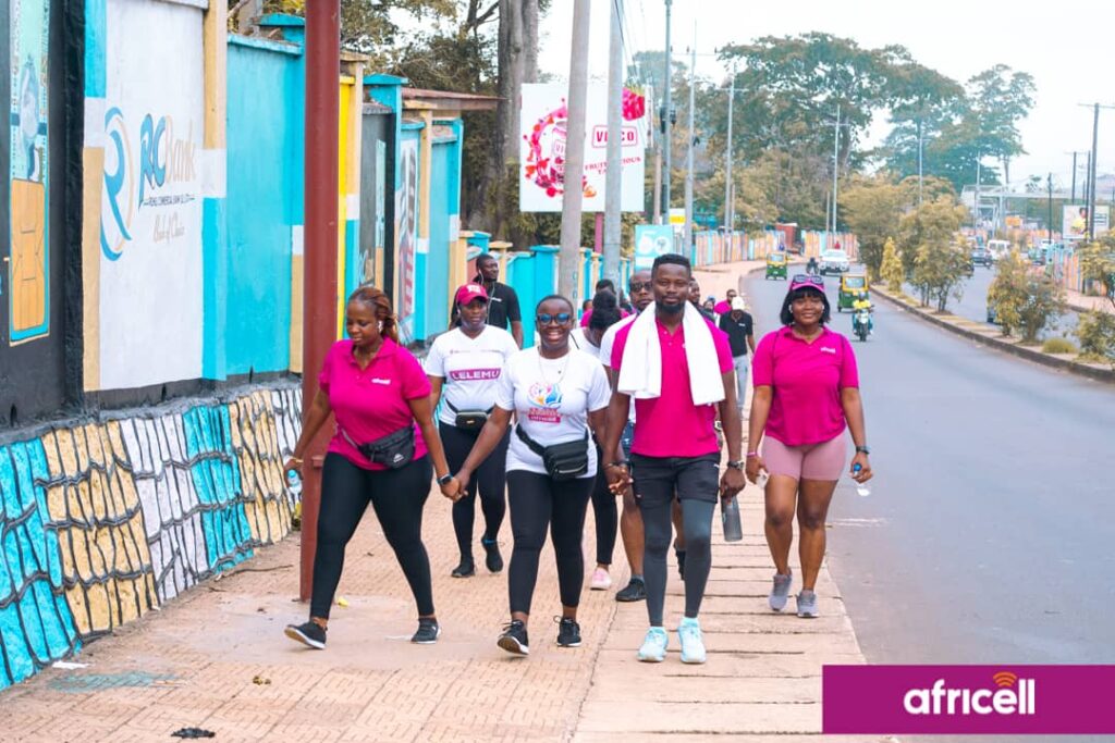 By Alusine Joseph Mansaray. The Africell Health and fitness walk was well attended by staff from various parts of the country as they started from the Africell headquarter at Wilberforce and designated to Leicester Peak on Saturday the 20th May 2023. Addressing the gathering at the finished point, the Chief Cooperate Affairs Manager of Africell Jose Abass Bangura said every employer knows that the most important assets to any company are their employees as the ultimate goal employers want from employees is to reach maximum productivity levels and in a quest to accomplish such supporting fitness is one of the most beneficial choices any employer can make to encourage their workers to reach their full potential. Joe Abass Bangura furthered that as a company they decided to organize the Africell health and fitness walk to improve employees’ health and wellness, reduce healthcare costs, and increase engagement and job satisfaction. Also, Joe Abass Bangura said during the health and fitness work the management of Africell provided some first aid treatments and as well vehicles for those whom might get hurt during the work but however thank God there was no casualty during the process. Mr. Bangura continued that this initiative will help employees not to get sick easily as when an employee uses less sick days, they contribute more to overall productivity and reduce the hassle of trying to find replacements at the last minute. He added that employees who are fit creates a sense of confidence, which allows them to set higher goals and to always strive for excellence and as well encouraging exercise is a good way to promote teamwork which encourages personal growth, increases job satisfaction, and reduces stress during and after work. On his path, the Media Manager of Africell, John Konteh said as a company they decided to embark on lots of sporting activities like the health and fitness walk, the LELEMU inter-departmental football tournament, the Sports meet and the Africell Freetown marathon as a way to keep their workers fit physically and psychologically which help reduces employees’ stress levels as a good exercise has the phenomenal ability to lessen the amount of stress felt from physical and emotional tensions in life. John Konteh furthered it is obvious that employees who are not stressed are more focused as they contribute to a much higher level of productivity. Similarly, John Konteh said that involving in sport helps you stay in shape, teaches you how to organize your time, boosts friendships, and builds relationships with your peers and adults in and outside place. John Konteh added that as a company they are very passionate about sports as there are lots of empirical evidences of their support to some of these sporting disciplines such as football, volleyball, crickets as the list goes on. John Konteh continued that the Africell inter-departmental LELEMU tournament will commence on Sunday the 28th May 2023 at the SS camp X-tray Arena and therefore called on their valued subscribers to witness football at its best as they have talented players which have the skills and enthusiasm to play football. John Konteh concluded by thanking all those that made it humanly possible to attend this epoch-making Africell health and fitness walk initiative. The Africell health and fitness work was climax with a group photos and merriments in a quest to show gratitude for making this event a success. Africell is the leading telecommunications company in Sierra Leone that has invested in various sectors in the country such as entertainment, education, health, infrastructure etc. and as well gives local talents the platforms they deserve by bringing them to a wider audience.
